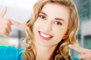 Woman Showing Her Porcelain Veneers
